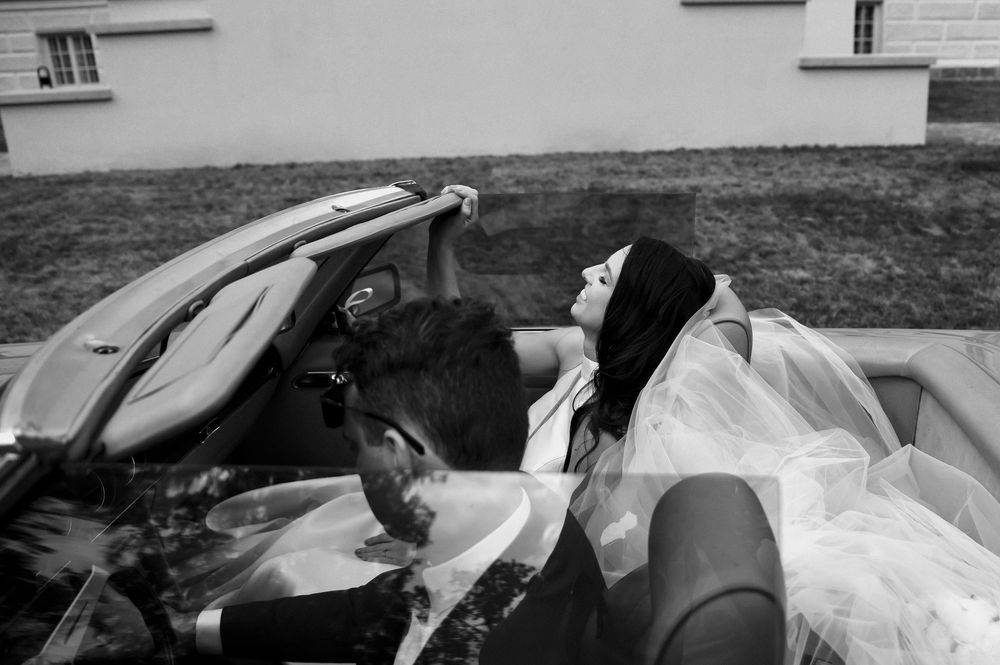 A collection of black and white photos showing various angles of an old car with damaged bodywork.