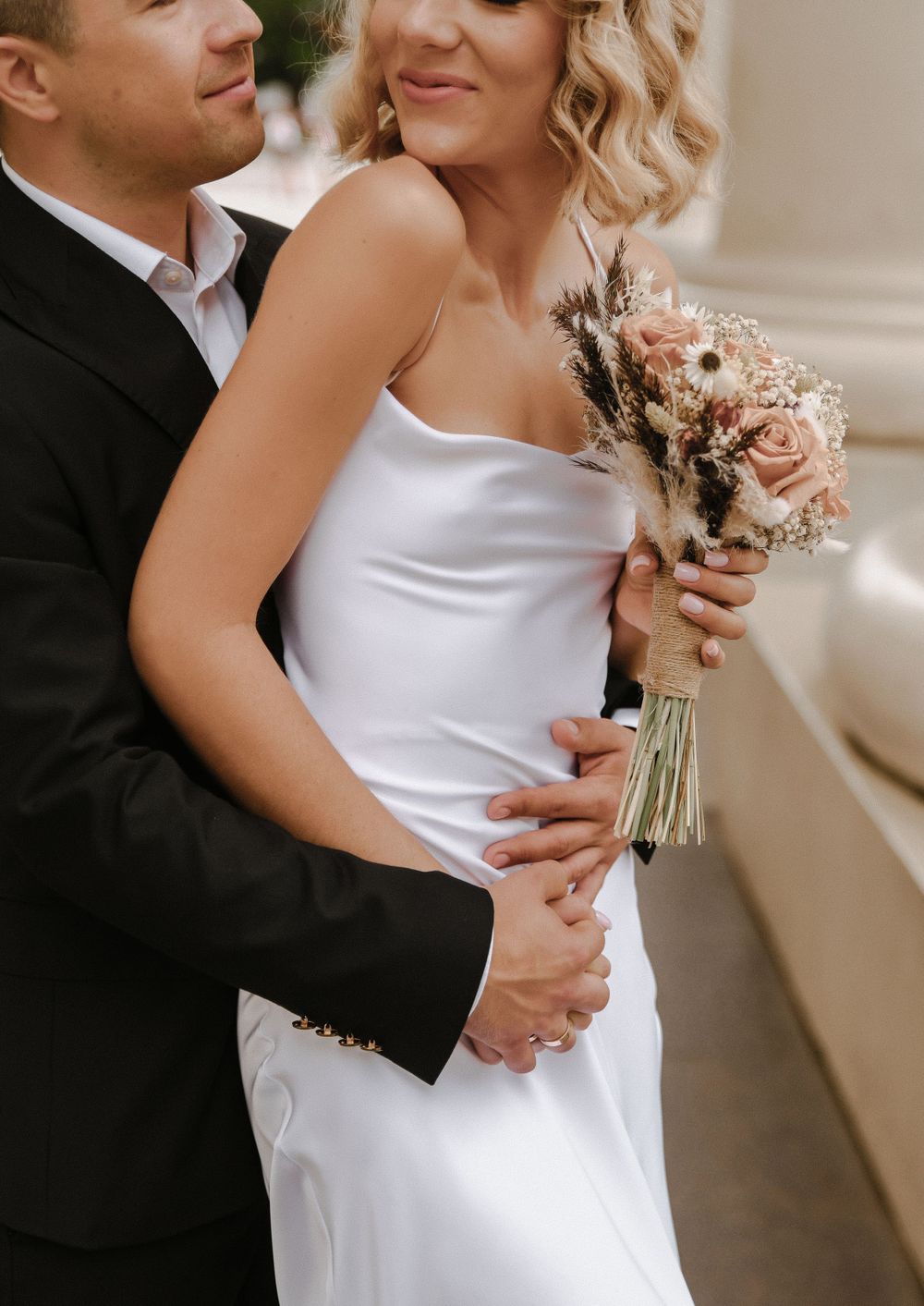 Close-up series of romantic wedding moments focusing on the dress and bouquet details.