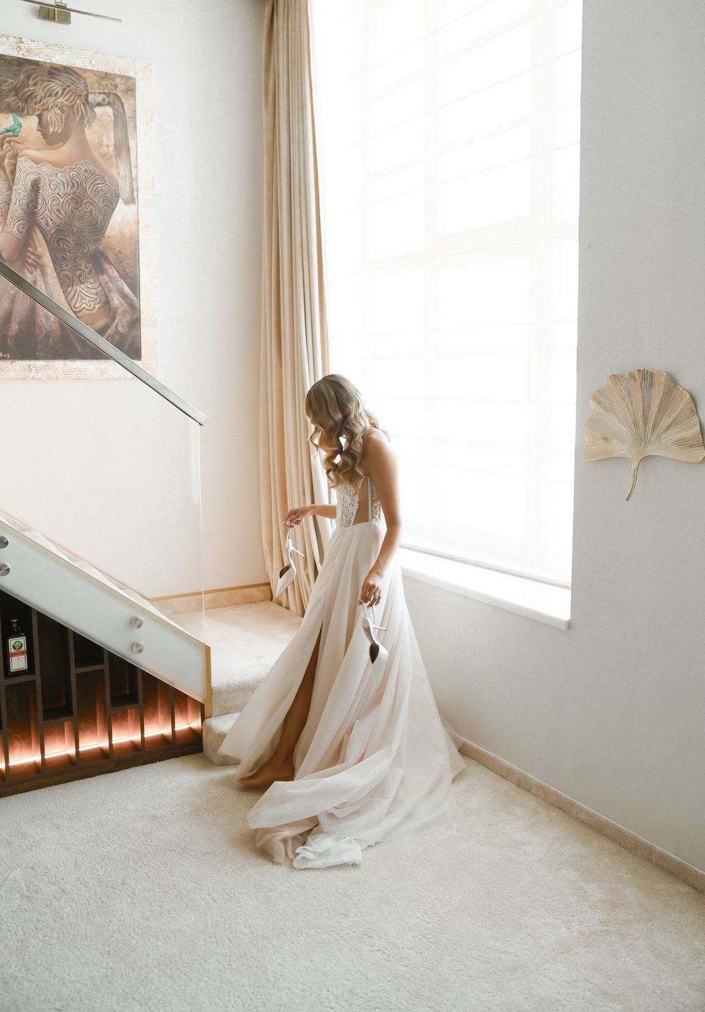 A series of ethereal bridal portraits in a light-filled room with white walls and flowing curtains.