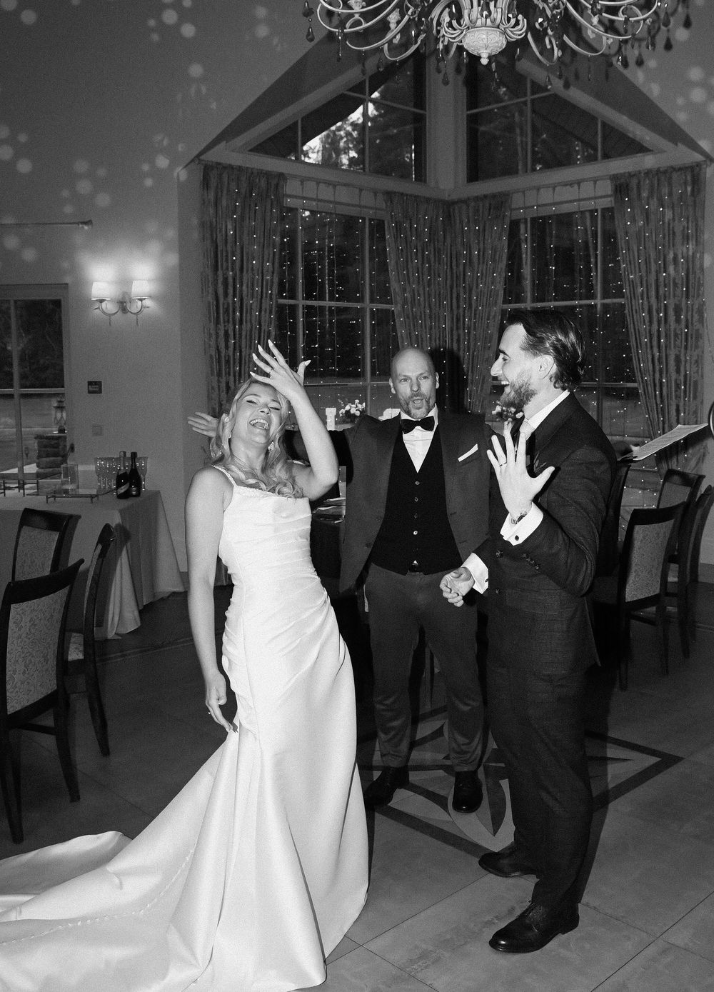Black and white photos show a couple dancing and twirling on a ballroom floor during a celebration.