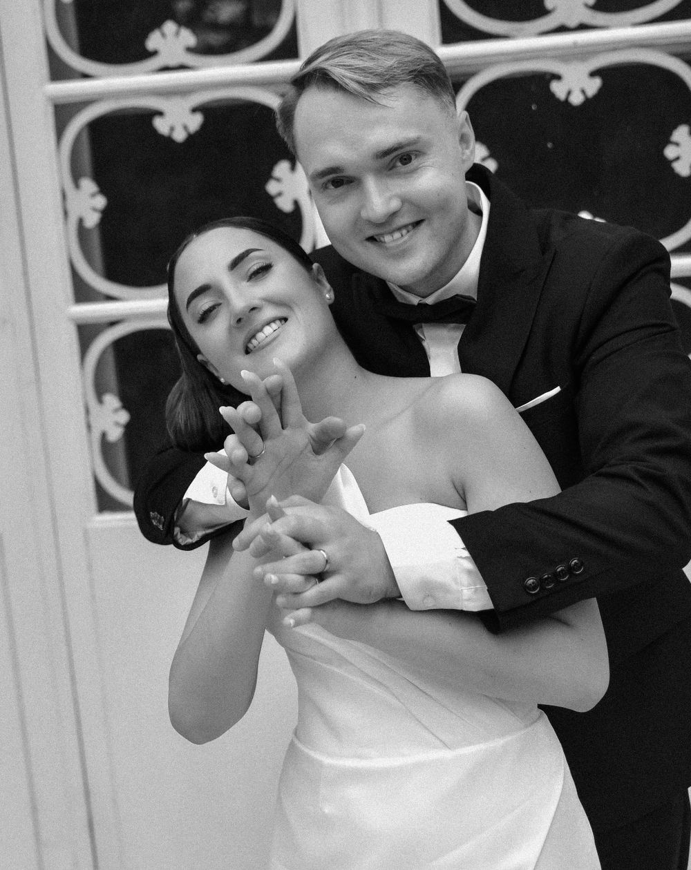 Close-up black and white shots of playful couple embracing and laughing together.