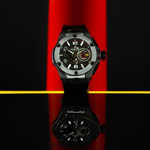 Stylish black chronograph watch with red background showing different angles and details of the timepiece design.