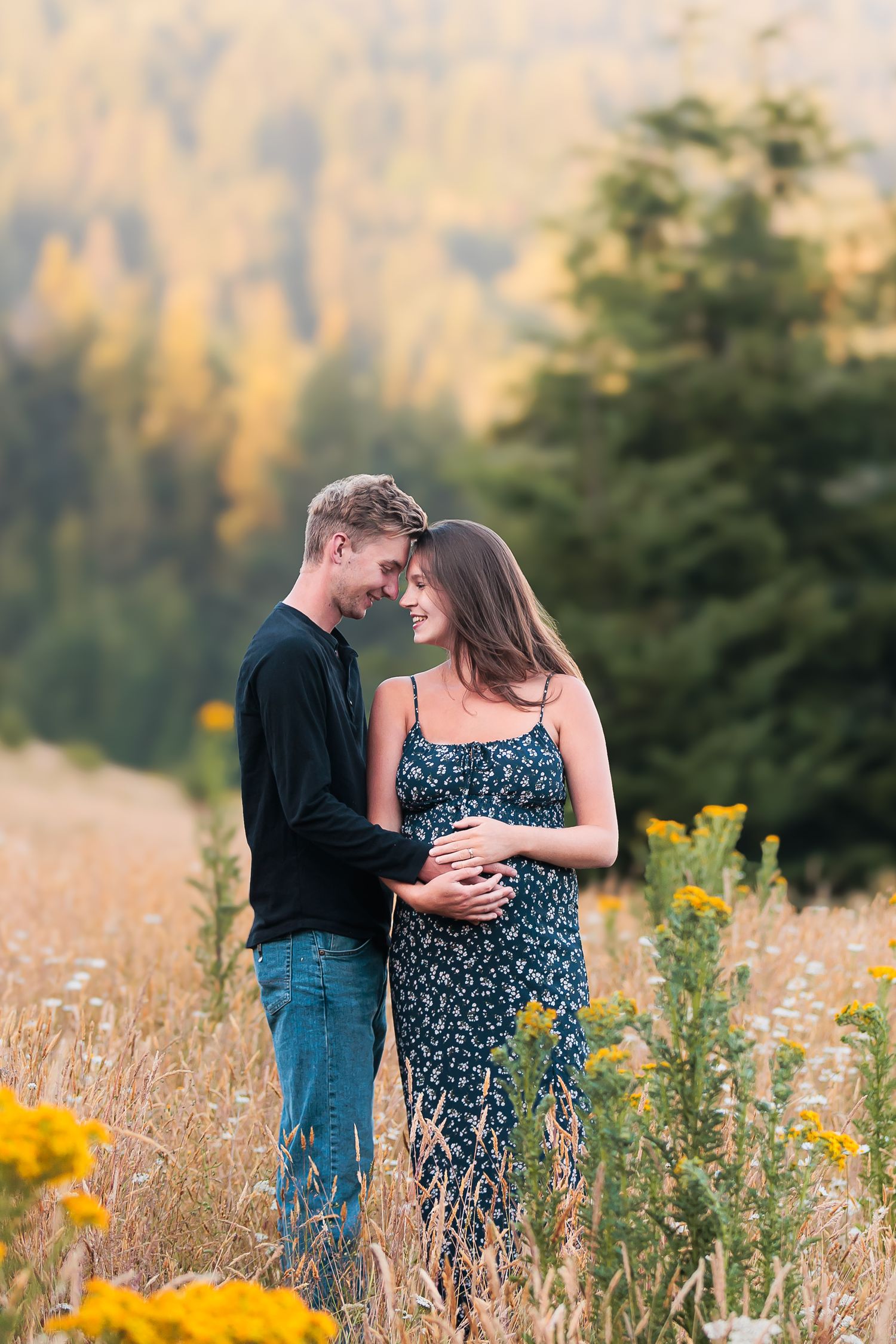 Mom and Dad to be get maternity photos captured by Taylor Carpenter Photography in a beautiful flower field