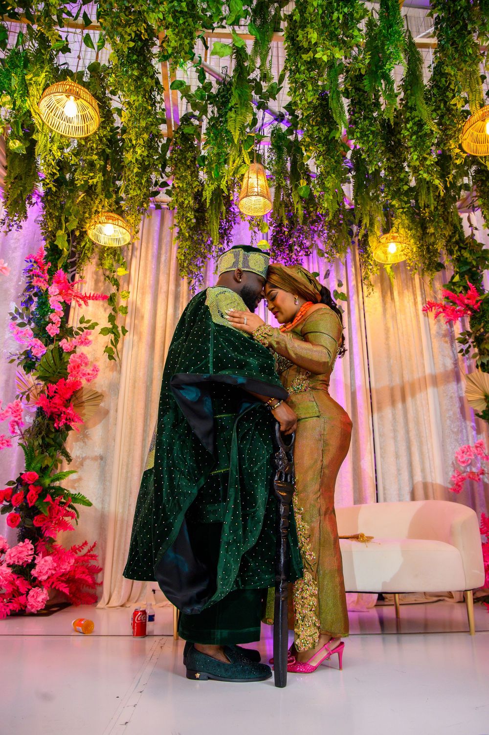 A romantic marriage proposal sequence showing silhouettes against a floral backdrop with hanging lights and pink decor.