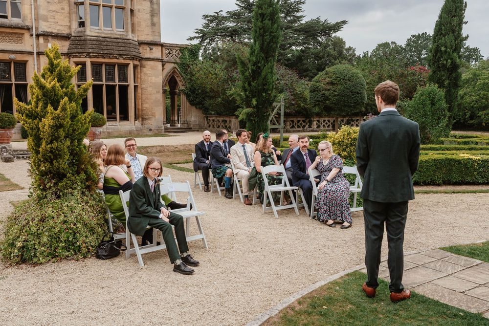 Wedding at Manor by the Lake Cheltenham Gloucestershire  groom waiting outside