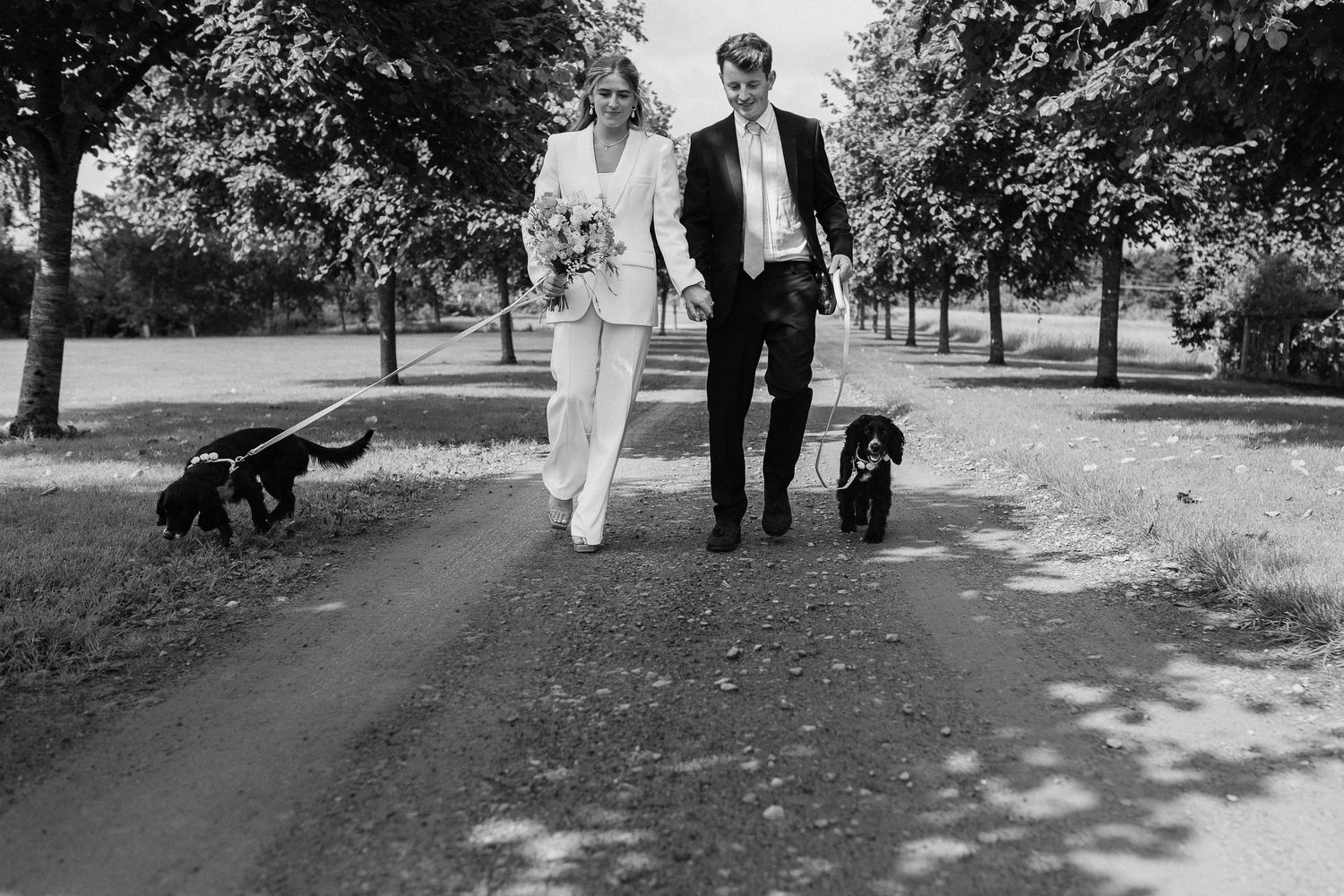 Bride and Groom Wedding photos in black and white with black dogs in Yorkshire