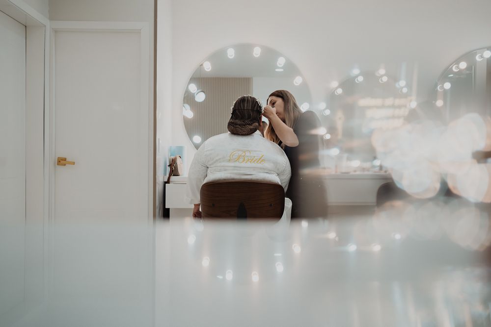 Several overlapping photographs on a blurry white wall with string lights creating a dreamy, bokeh effect.