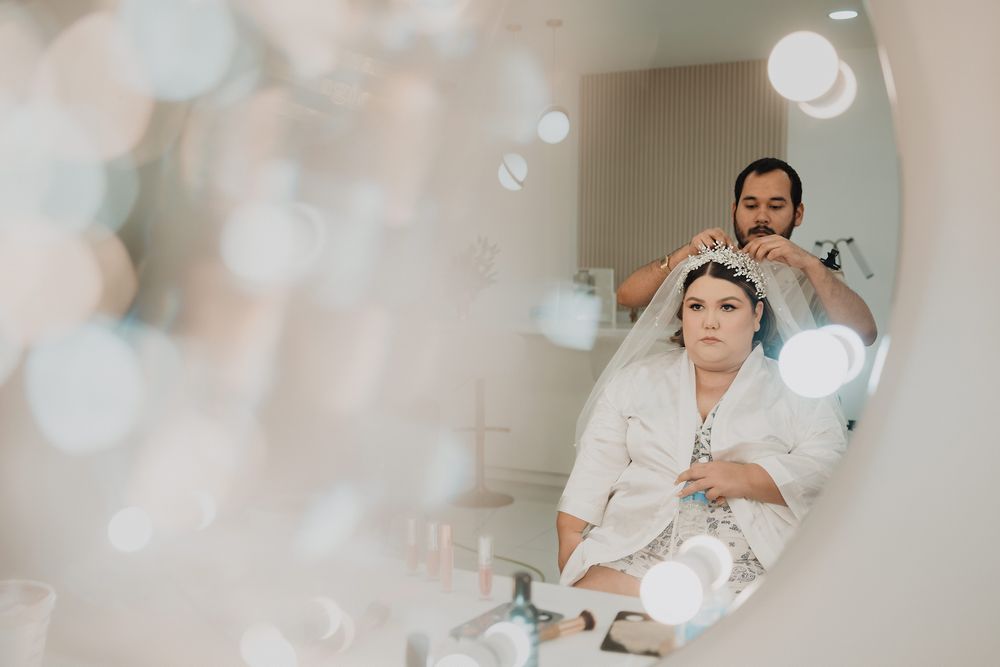Professional getting a pampering spa treatment with glowing bokeh lights in the foreground.