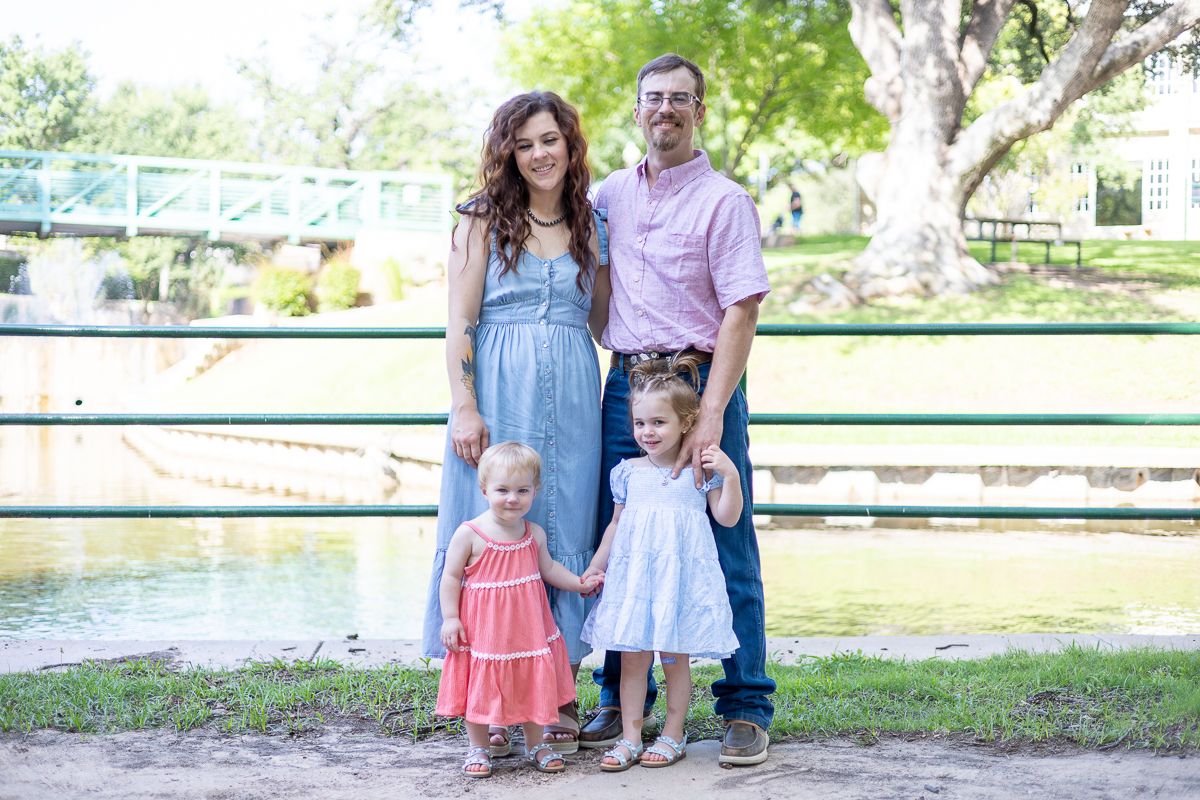 A series of outdoor portrait photos arranged horizontally showing a family group in casual attire in a park-like setting.
