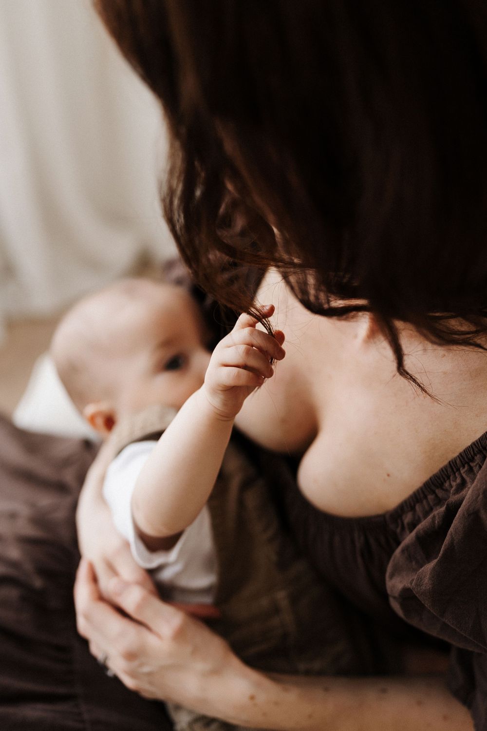 Intimate black and white close-up series showing gentle parenting moments.
