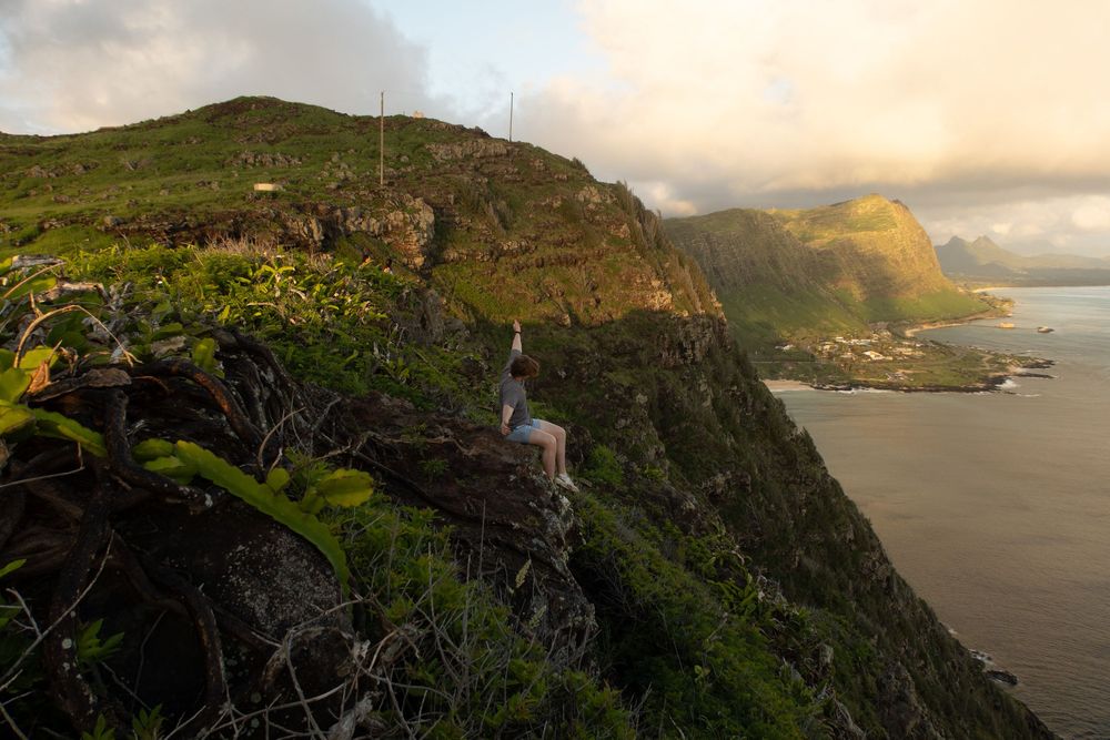 Dramatic seaside cliffs and steep coastal mountains at sunset along Maui's rugged Kalawao coast near Kalaupapa.