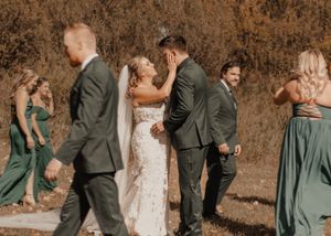 Trendy blurred photo of a bridal party strolling around a couple, beautifully captured in vibrant fall tones.