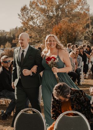 Wedding party walking down the aisle, filled with joy and excitement as they approach the altar.