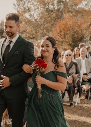 Wedding party walking down the aisle, filled with joy and excitement as they approach the altar.