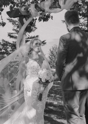 Emotional classic black and white photo of bride and groom at the altar, capturing a timeless wedding moment.