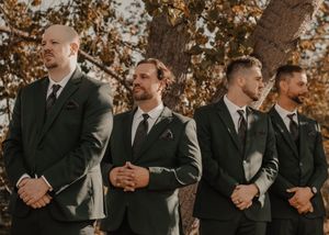 Groomsmen standing at the altar during the ceremony.