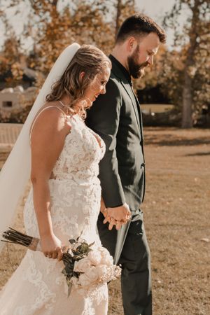 Bride and groom walking down the aisle together as a newly married couple