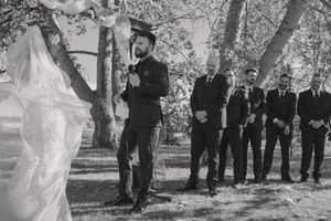 Classic black and white photo of bride and groom at the altar, capturing a timeless wedding moment.