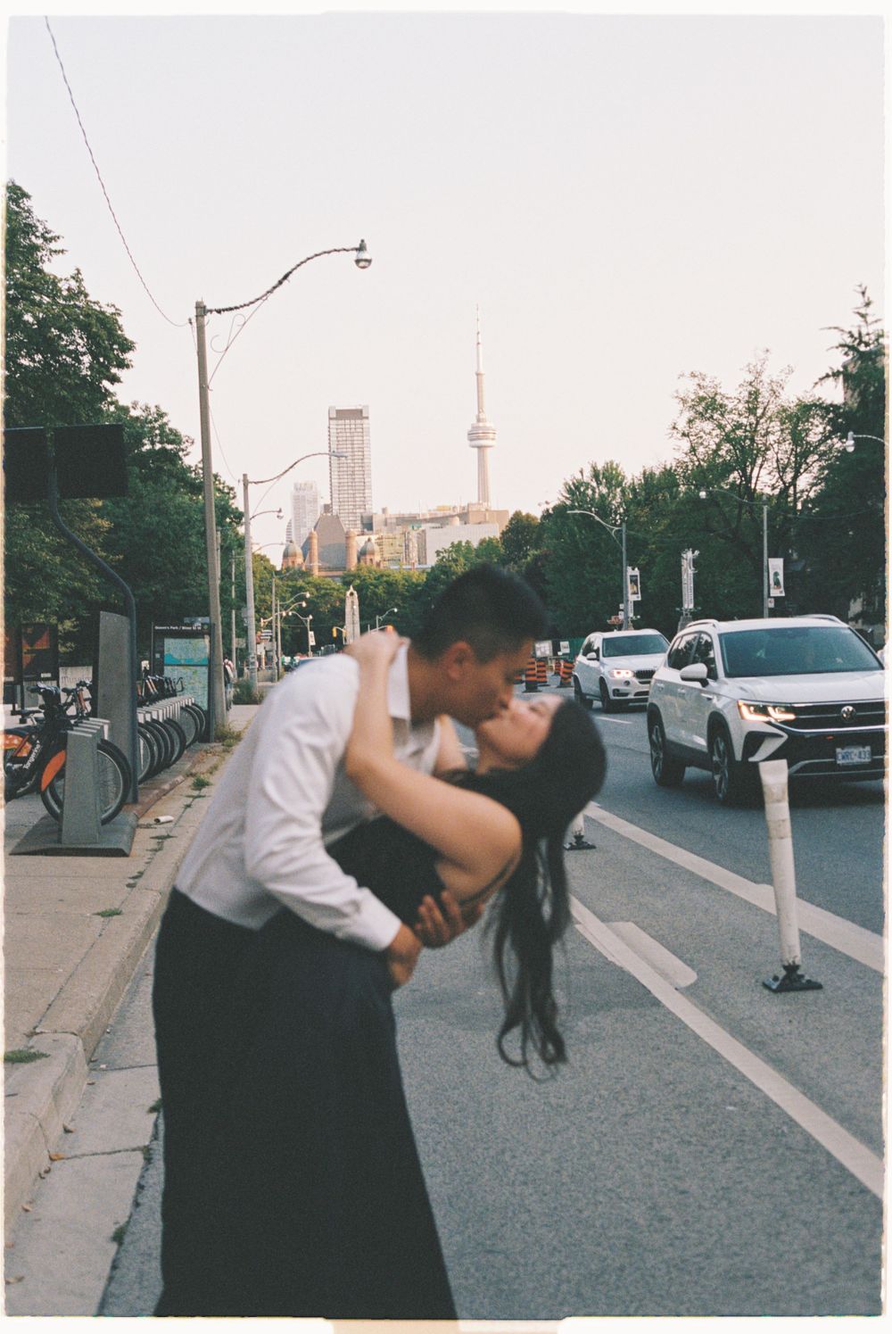 Romantic urban scene in Toronto with the CN Tower visible in the background.
