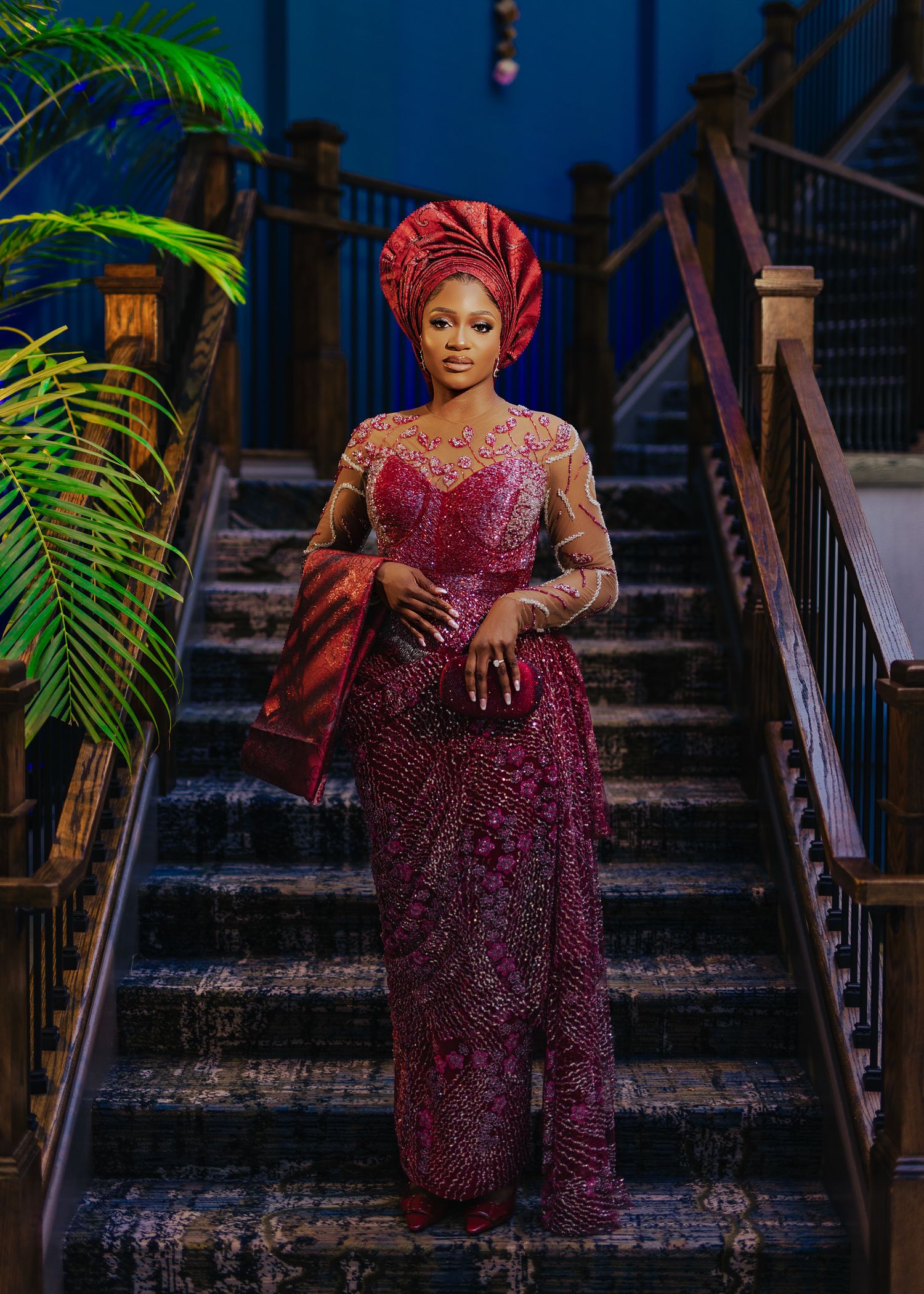 Sequence of photos showing a woman in burgundy formal dress descending ornate staircase with palm fronds.
