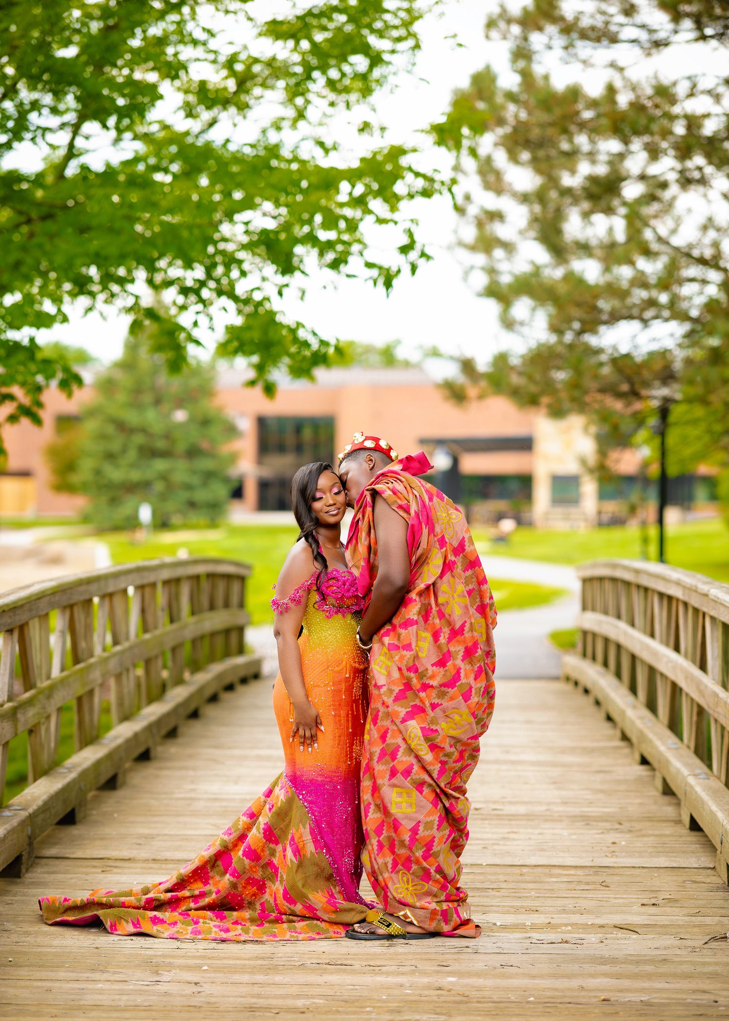 Vibrant pink and orange sari creates stunning contrast against wooden bridge walkway in outdoor photo series.