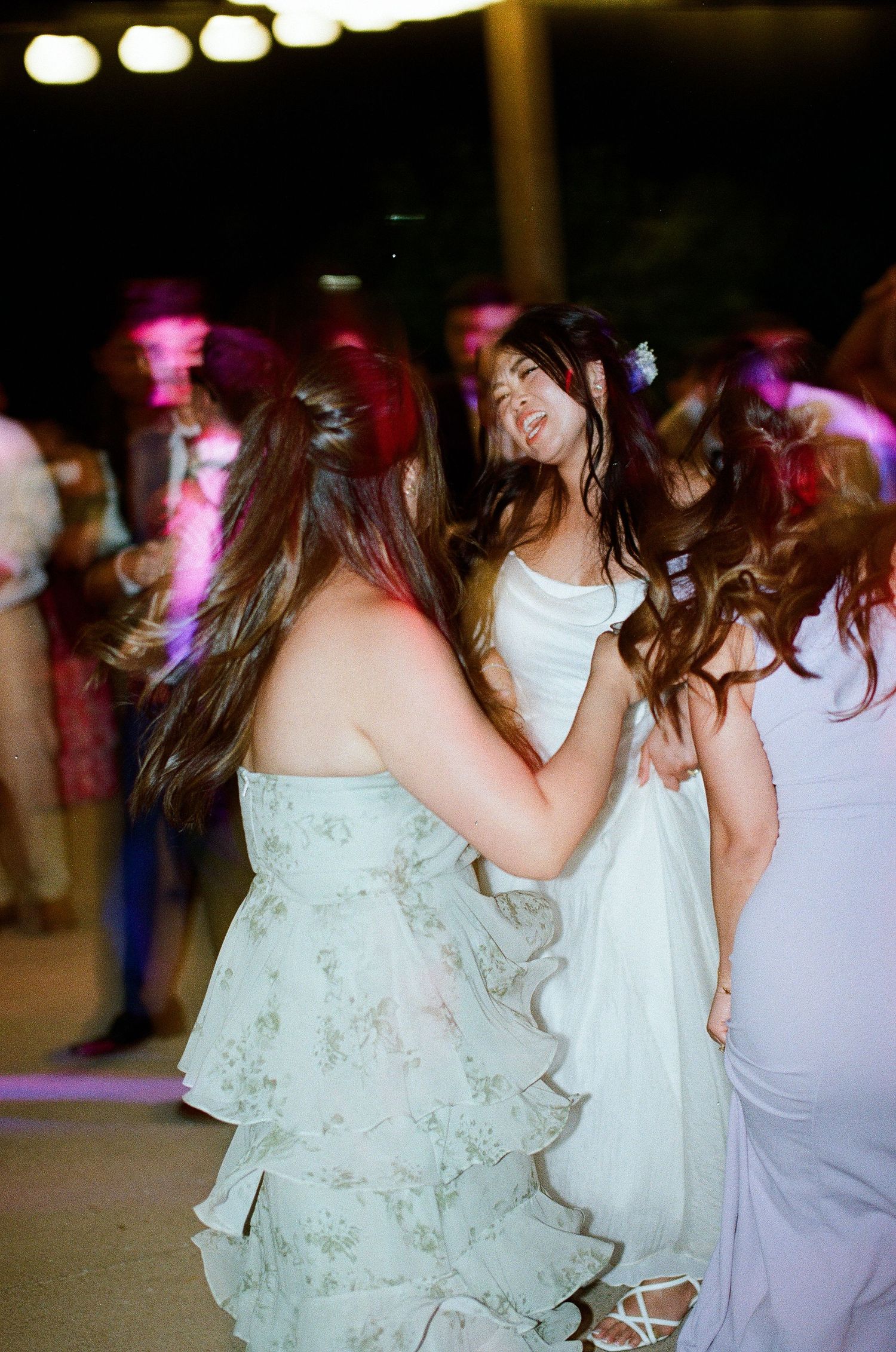 High-energy film photography of the lively dance party at the Aliso Viejo wedding reception in Orange County.