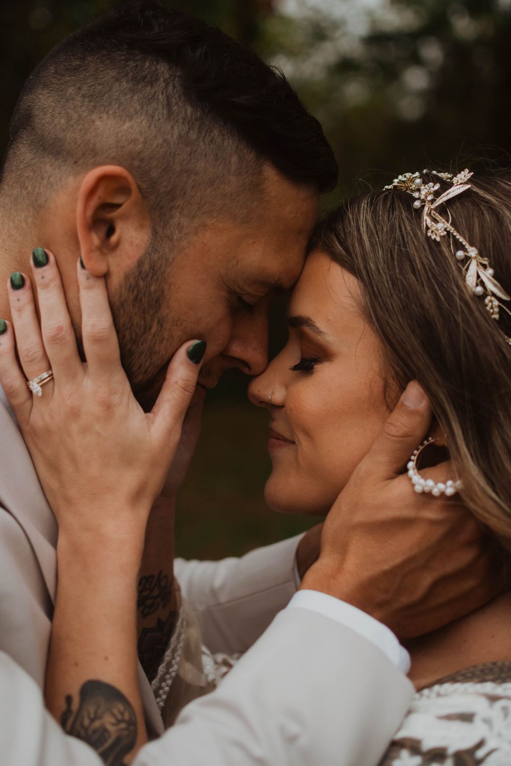 Close-up romantic wedding photos showing tender intimate moments between newlyweds in soft natural lighting.