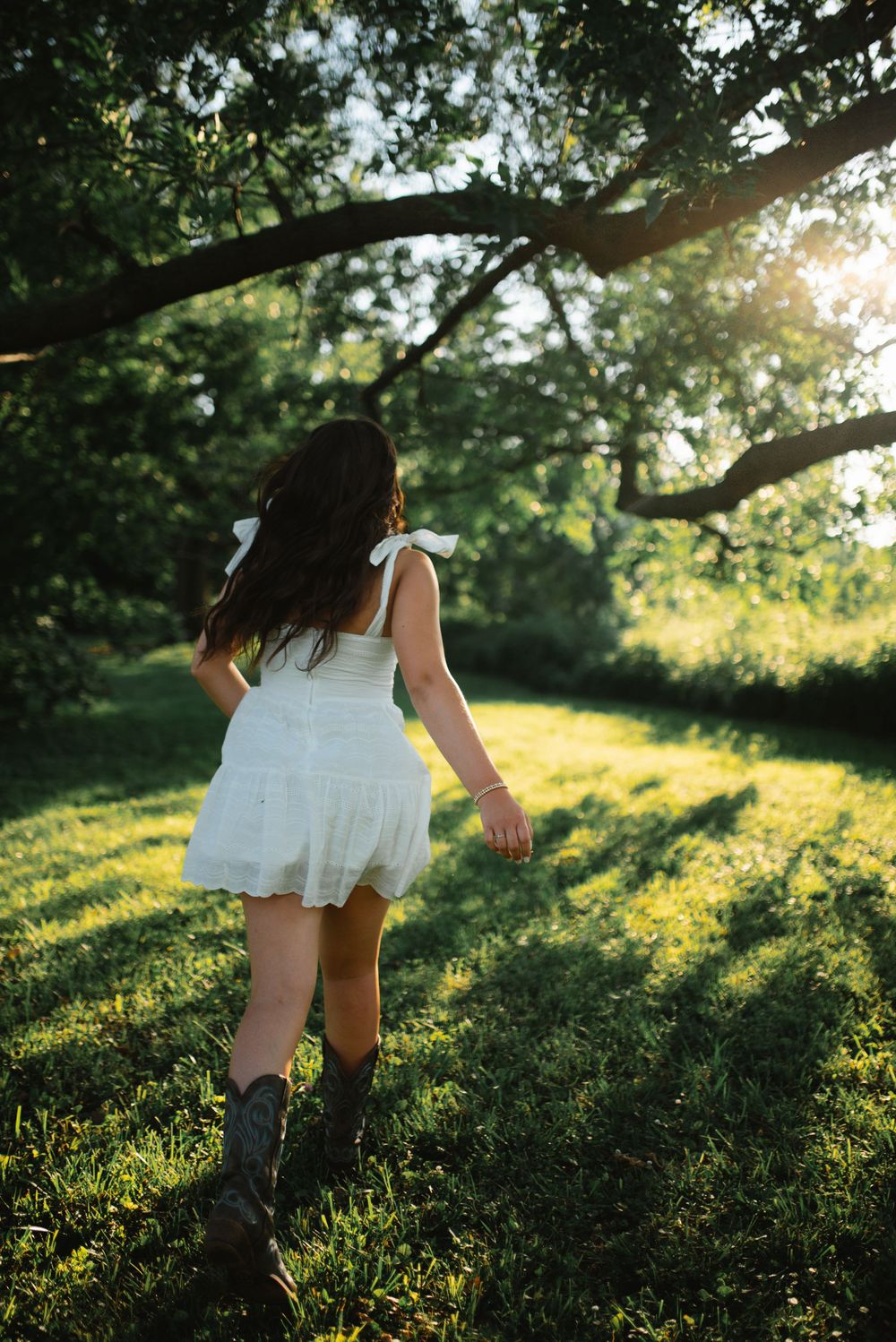 A sequence of dreamy summer photos capturing movement through tall grass in golden evening sunlight.