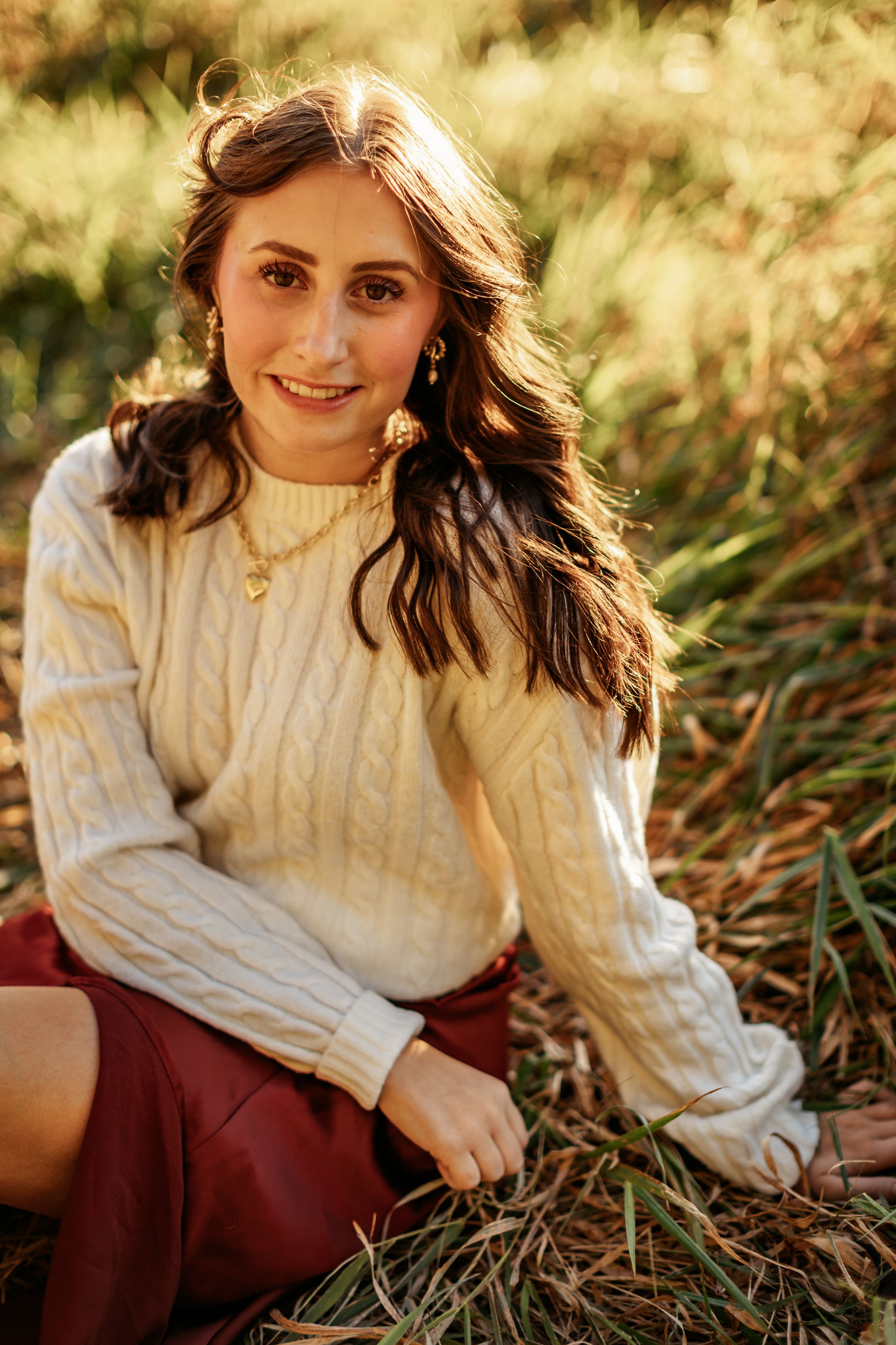 Girl sitting in grass