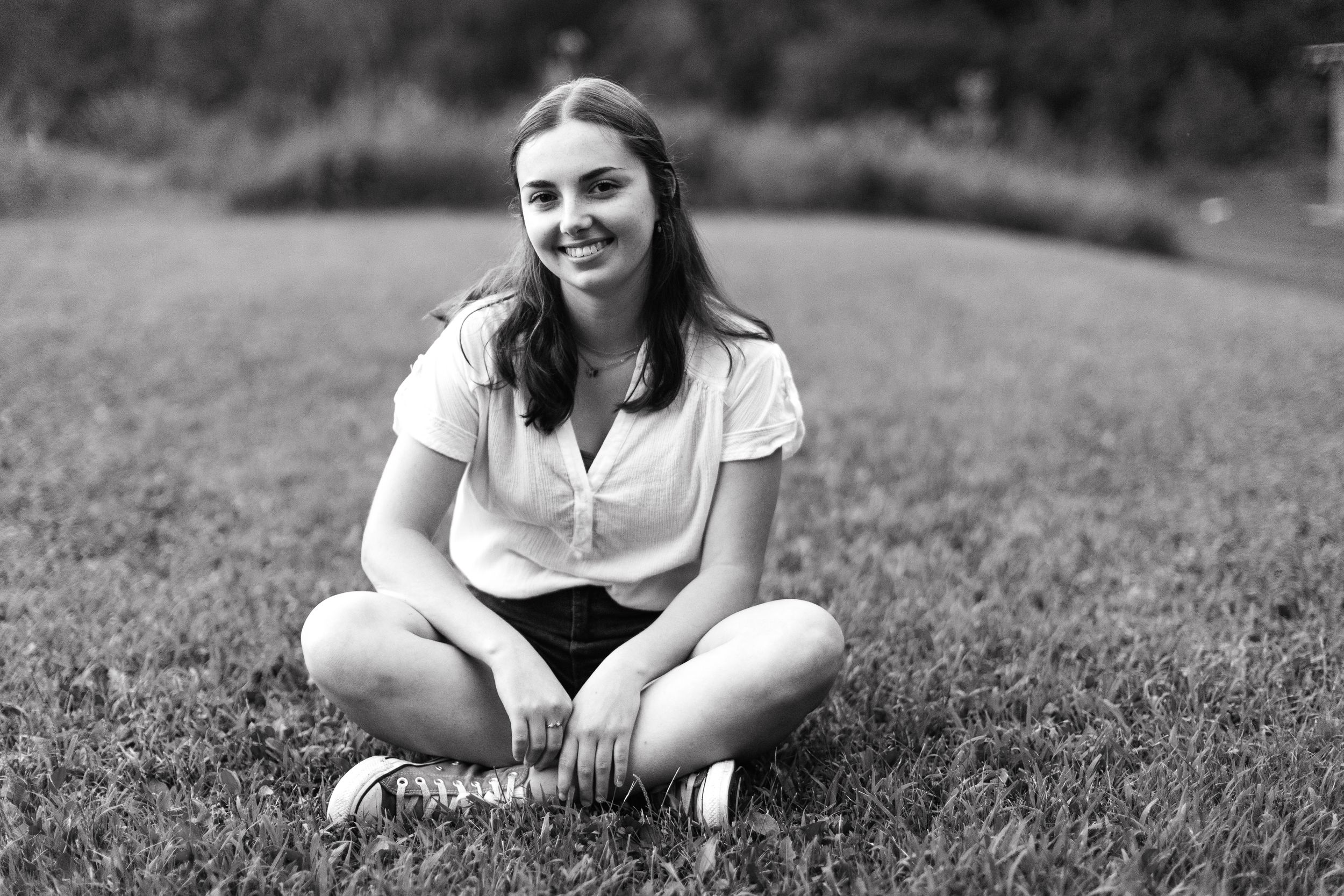 Girl sitting in grass