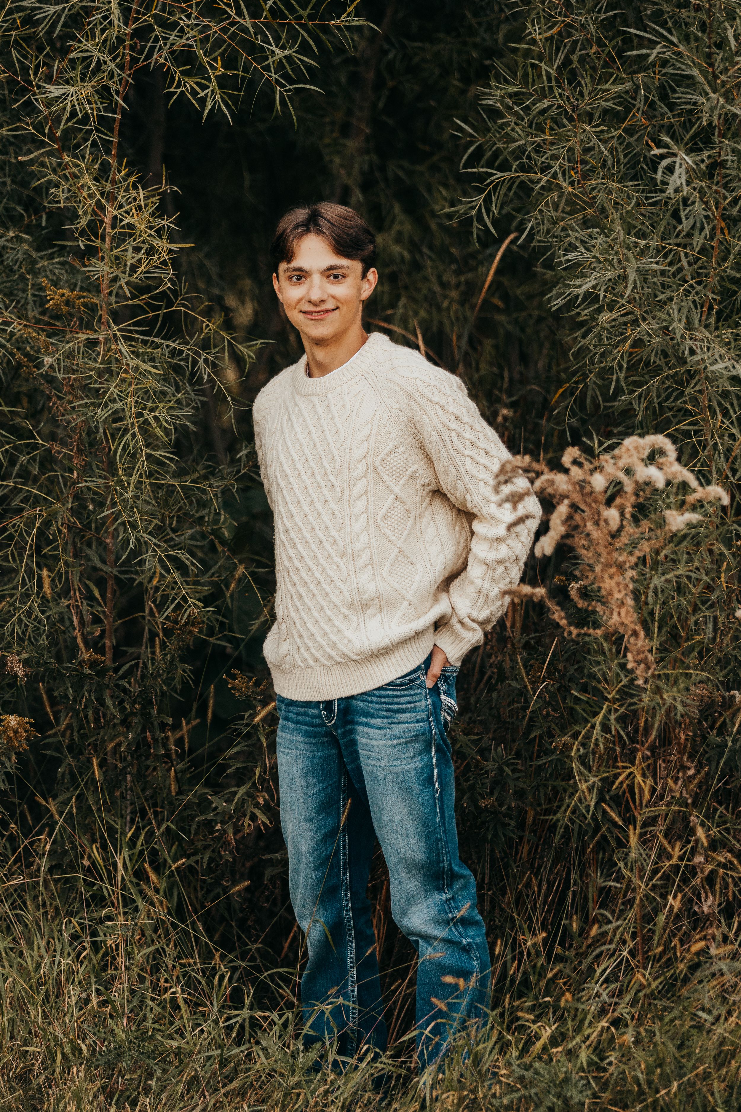 Boy standing in grass