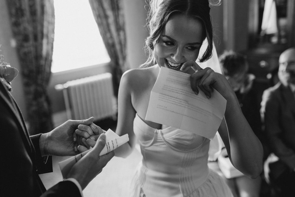 A collection of black and white wedding photos showing intimate moments between newlyweds.