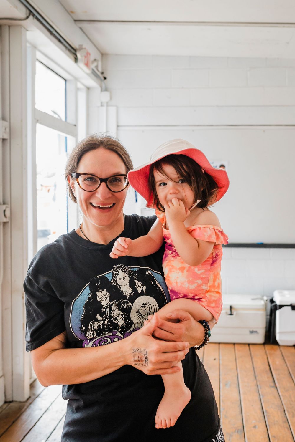 A series of joyful moments captured between two people in a bright indoor setting.