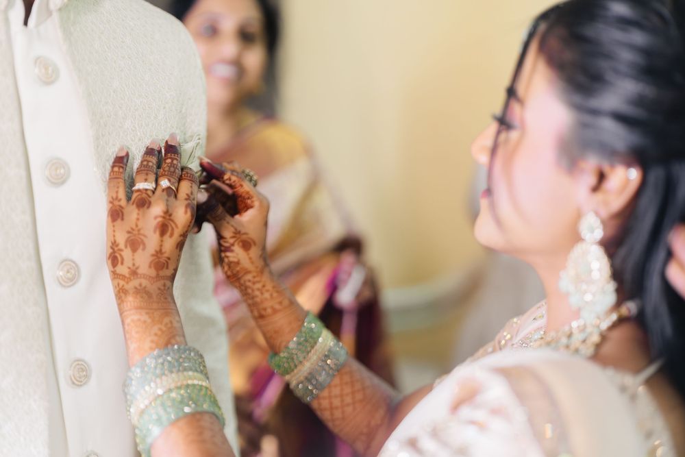Detailed shots of bridal makeup application through ornate white frames showing preparation moments.