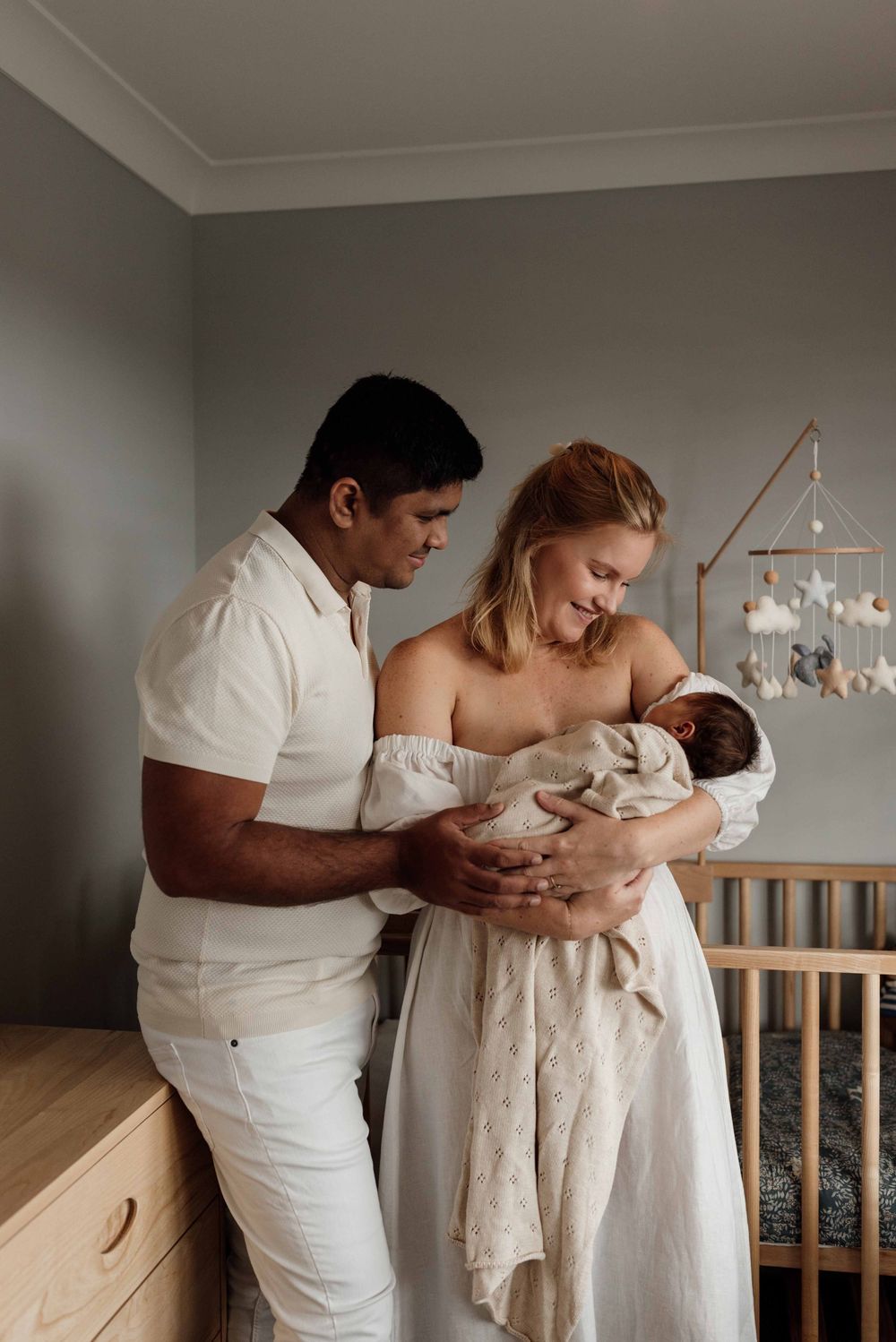 Family in nursery during in-home newborn session in Sydney’s Hills District.