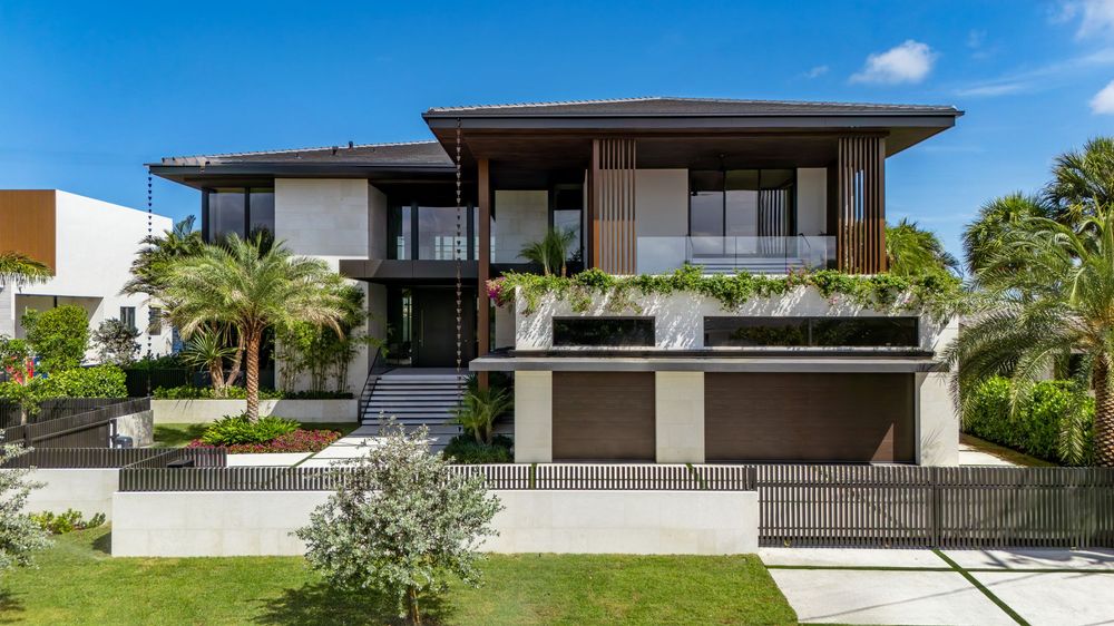 Panoramic view of contemporary waterfront architecture and private docks along Miami canal.