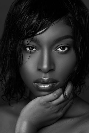 Stunning black and white closeup portrait showcasing natural beauty and flawless makeup.