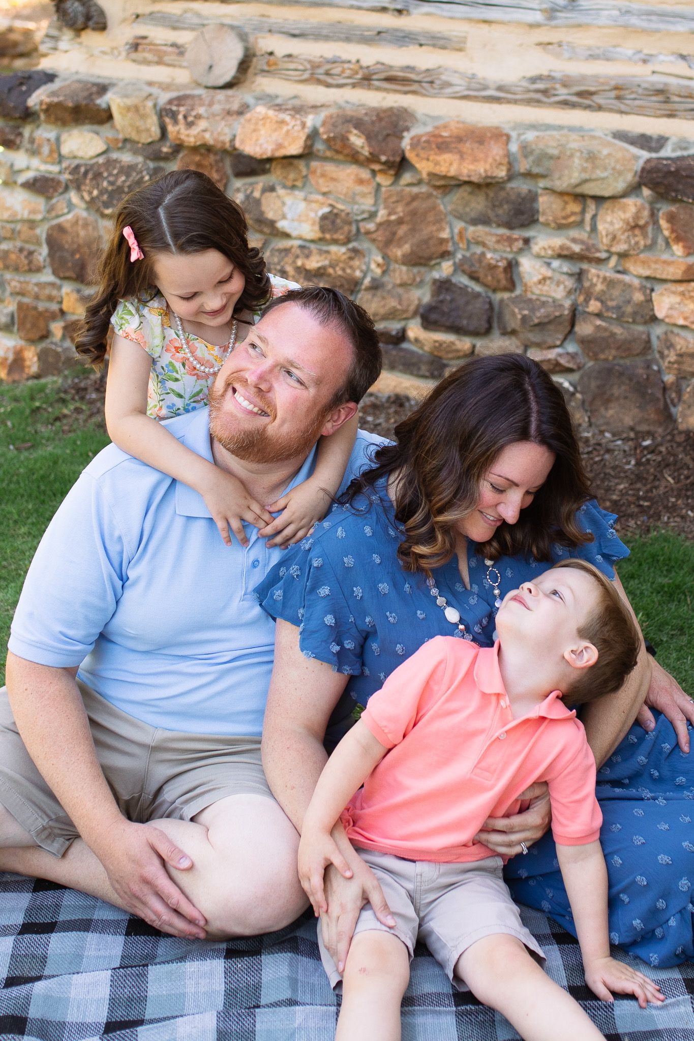 A family sits together and shares laughter at Yates Mill