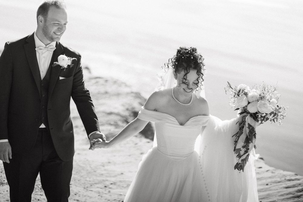 Black and white wedding photography collage showing beach ceremony moments with couple and floral details.