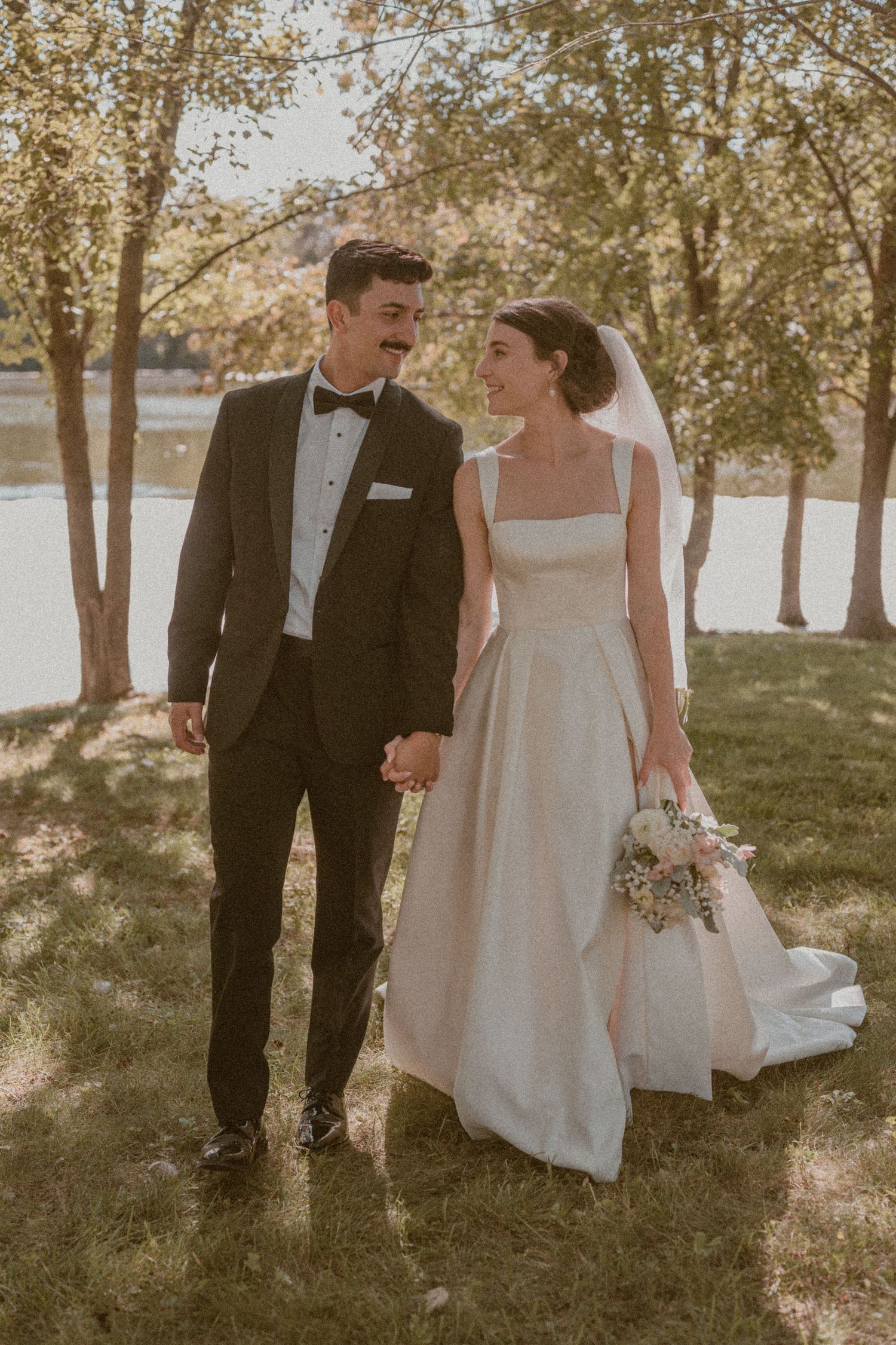 Bride and groom embracing during golden hour at Gaie Lea, Staunton, VA, playful, intimate, storytelling portraits.