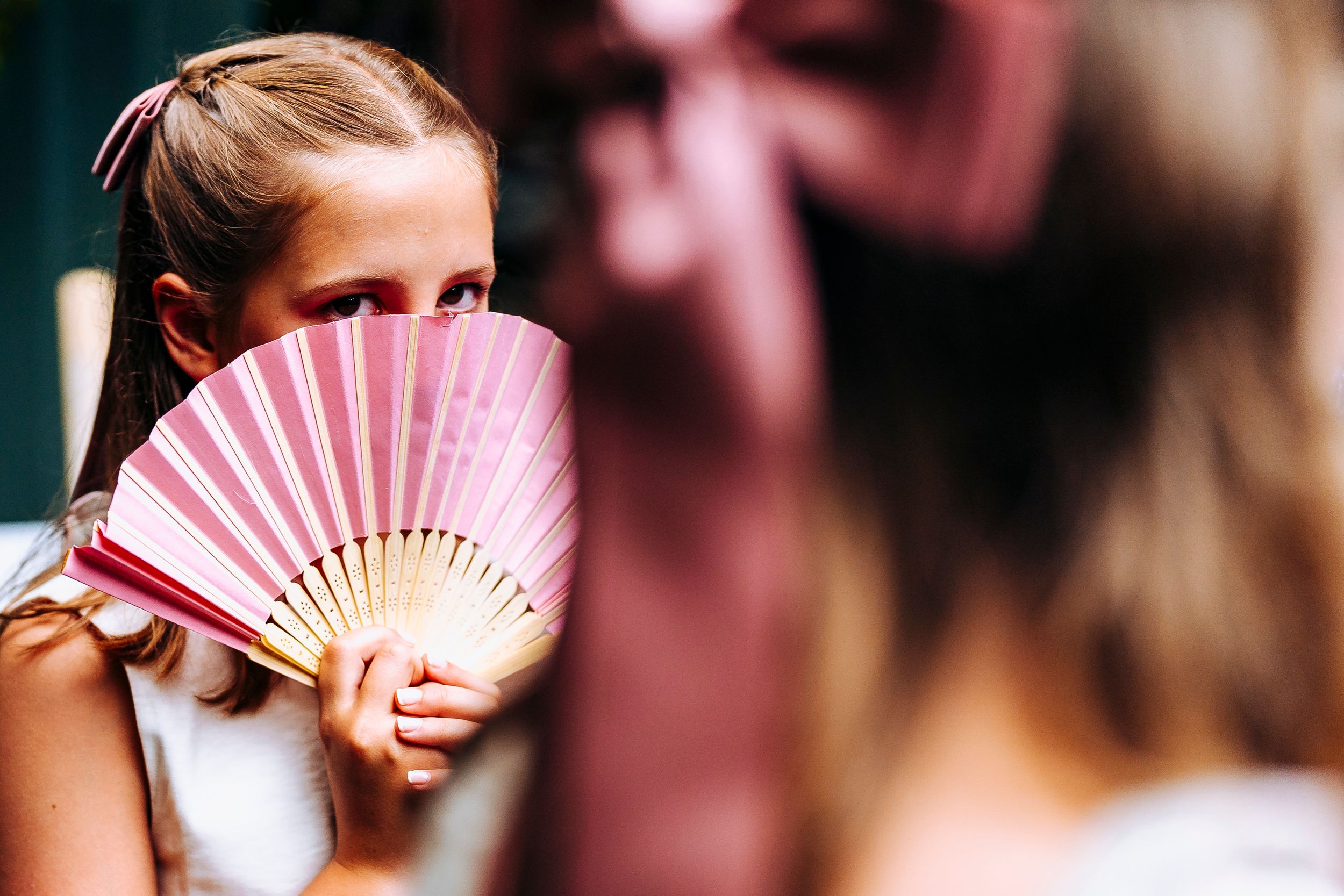Flower Girl Hiding Behind Fan