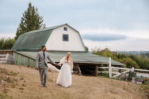 Panoramic series of wedding photos showing couple in formal attire posing in front of rustic barn and rural landscape.