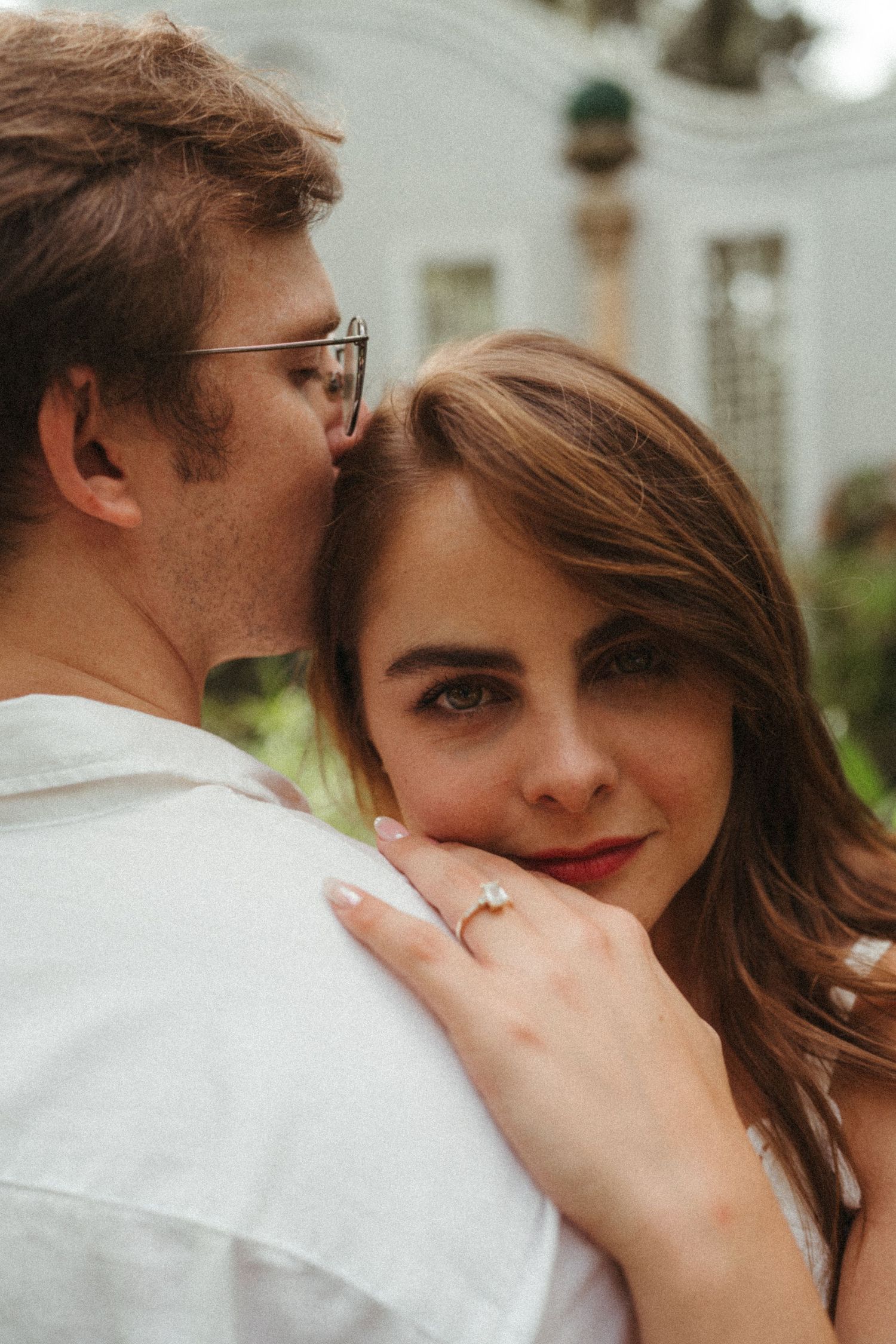 Close-up portrait series capturing intimate moments between a couple in soft lighting.