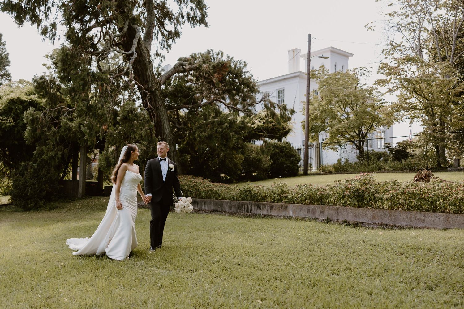 Couple walking hand-in-hand at The Bleak House, editorial wedding photography Knoxville TN