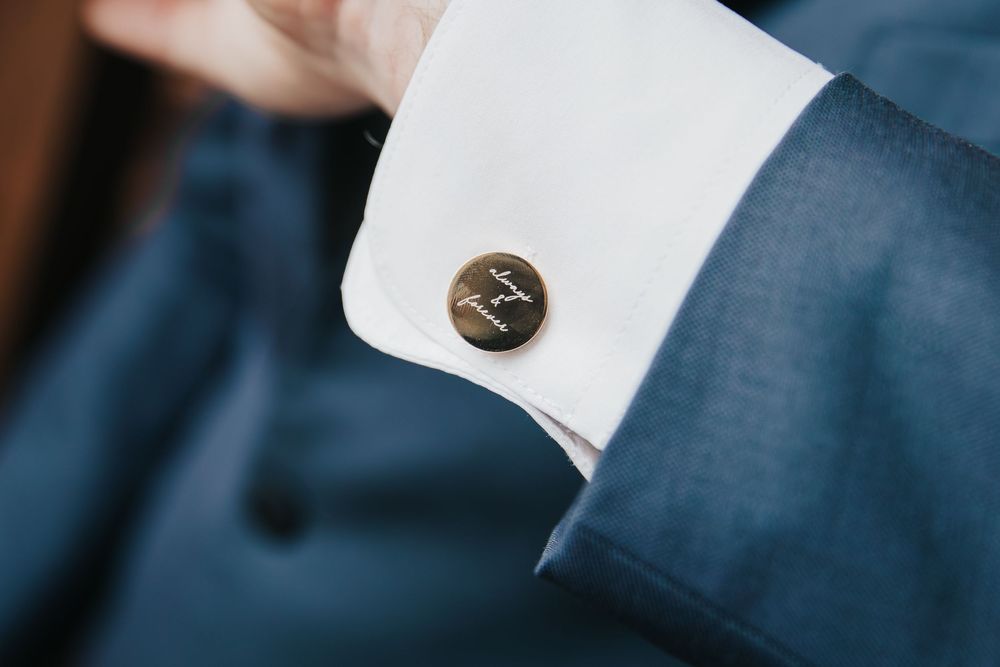 Close-up detail shots of formal attire including white shirt cuffs and navy blue fabric.