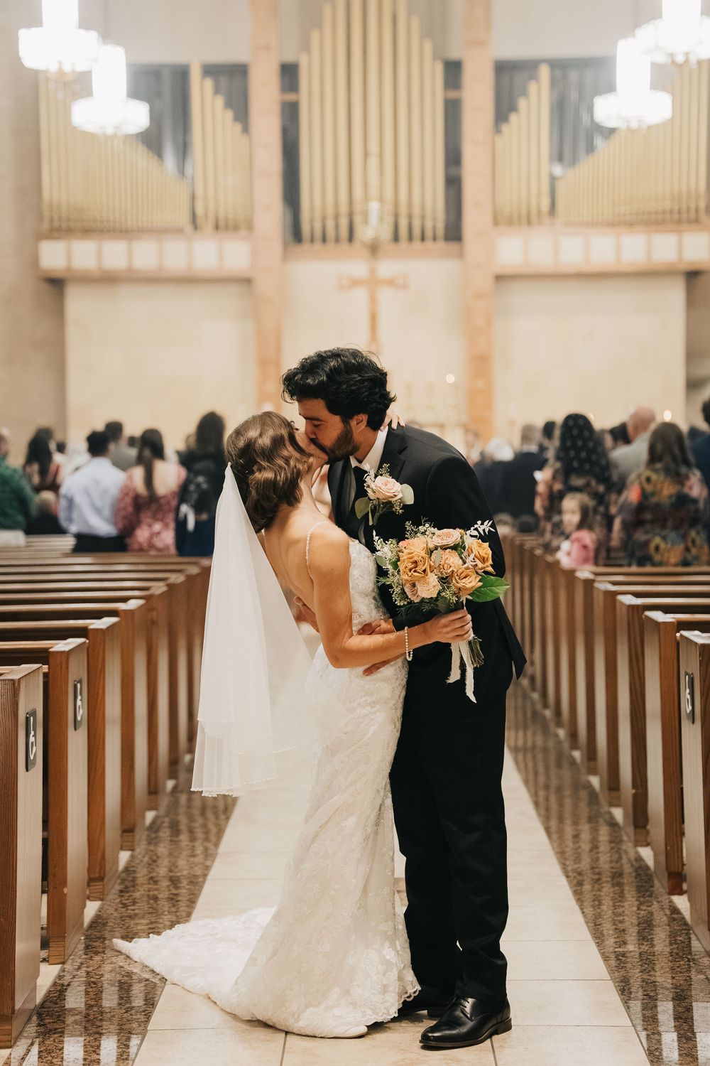 A romantic sequence of wedding photos showing a couple sharing an intimate moment in a church aisle.