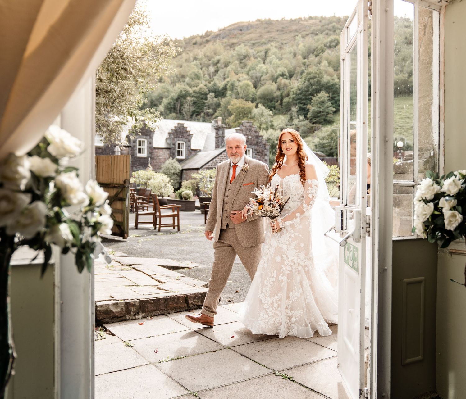 A collage of wedding photos showing white floral decorations and elegant outdoor venue details on a sunny day.