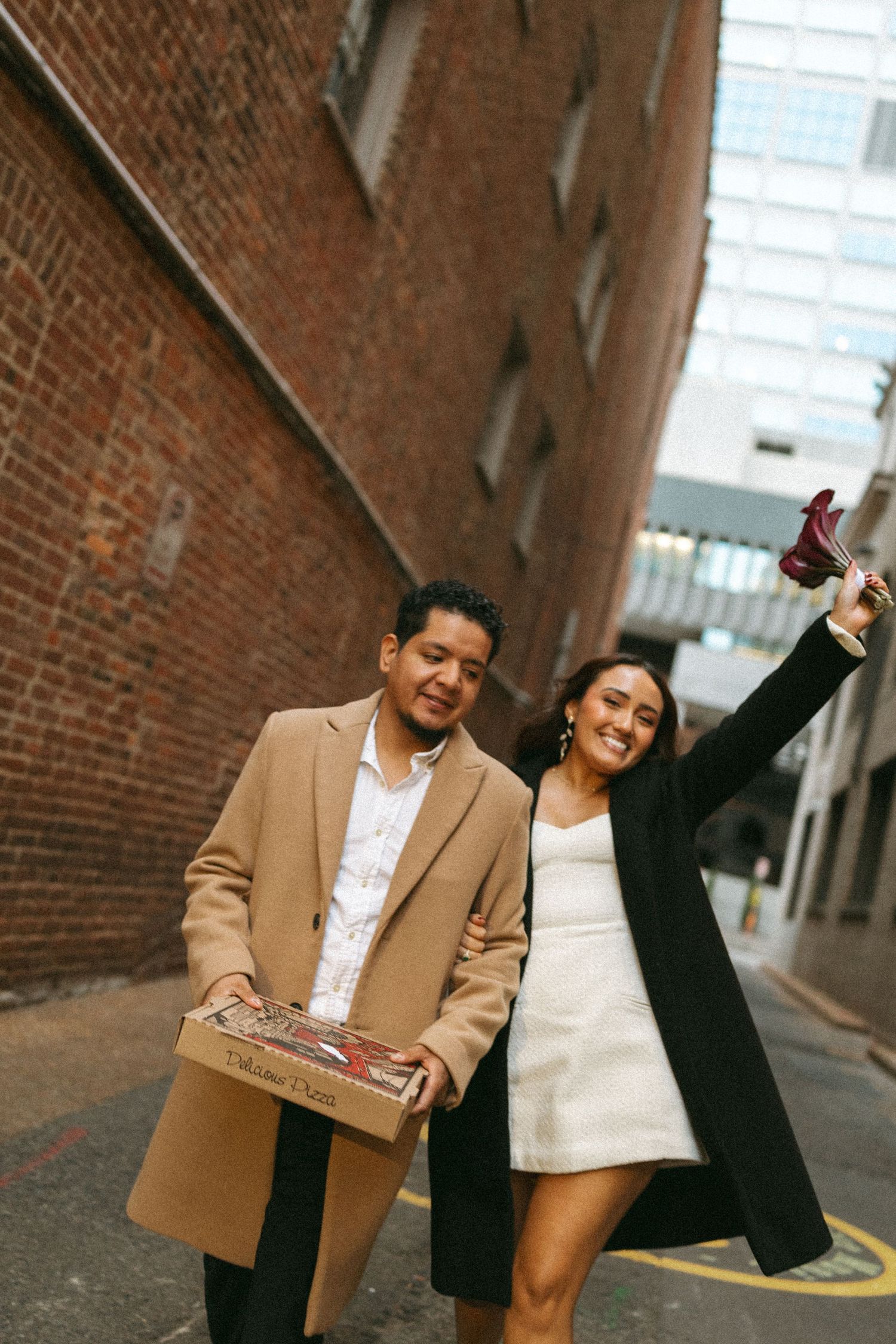 Nashville elopement photographer Karla Derry, couple walking on street celebrating