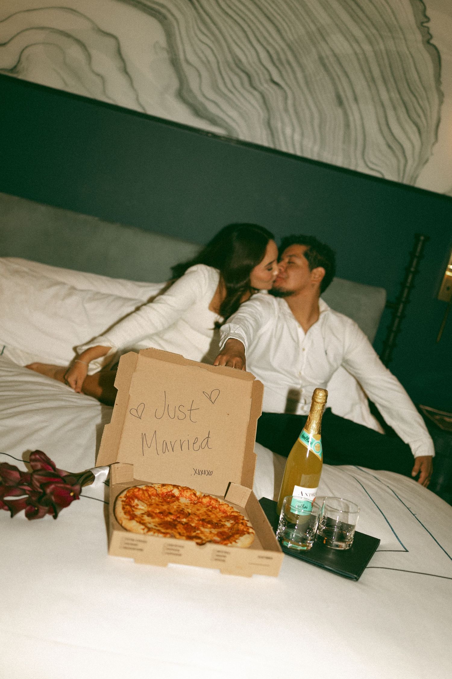 Nashville elopement photographer Karla Derry couple with pizza and champagne