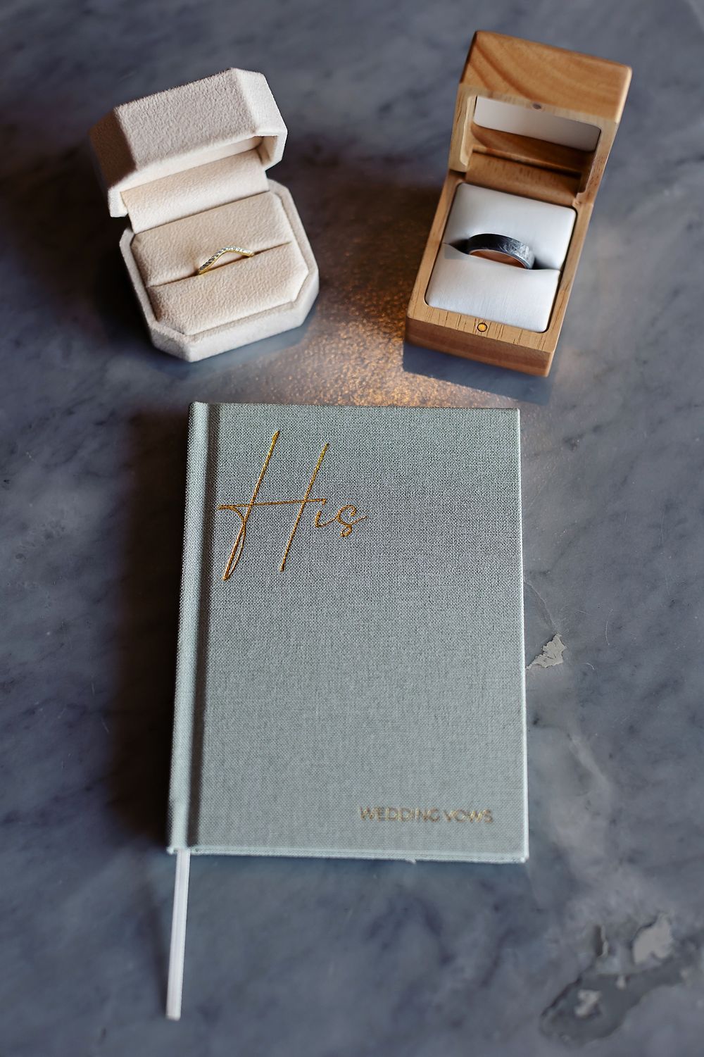 Wedding rings and vow books photographed at Secrets Moxché destination wedding.